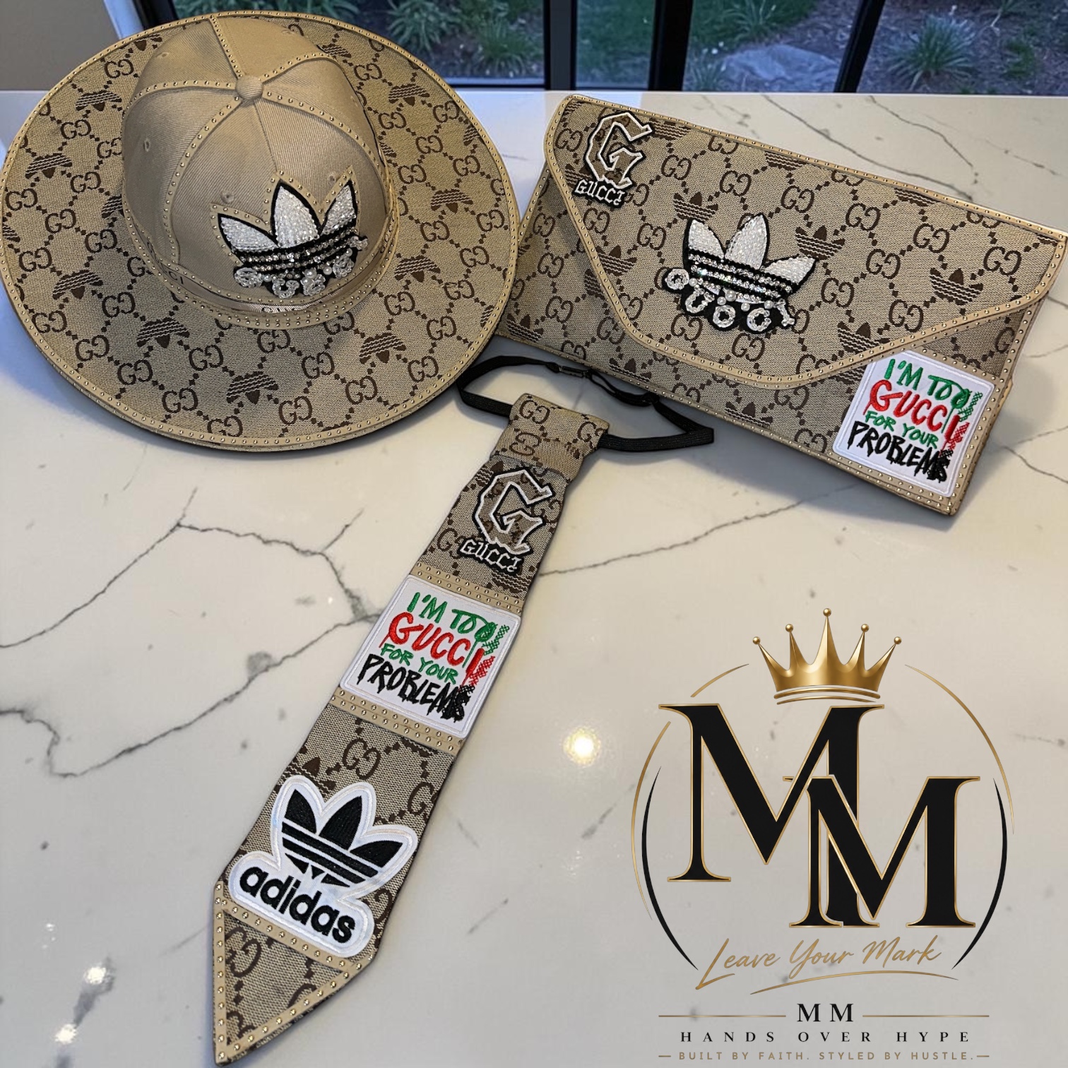 Custom tan patterned wide-brim hat, matching clutch and decorated tie set